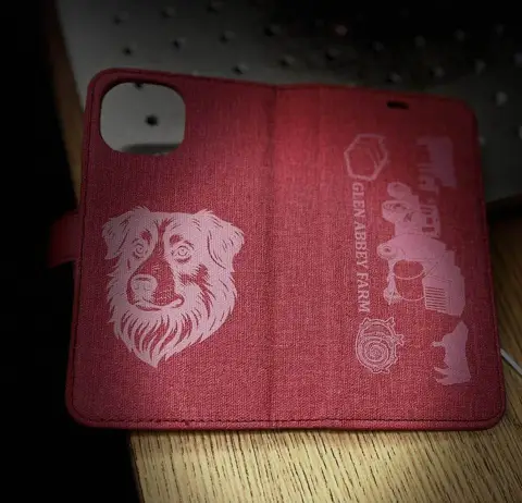 Collection of custom laser-engraved leather patches in different shapes and logos
